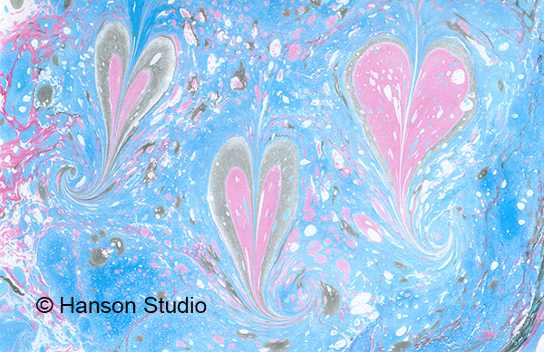 3 Pink Hearts on Blue Confetti
